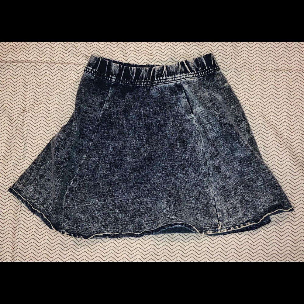 A denim acid-washed looking mini skirt.